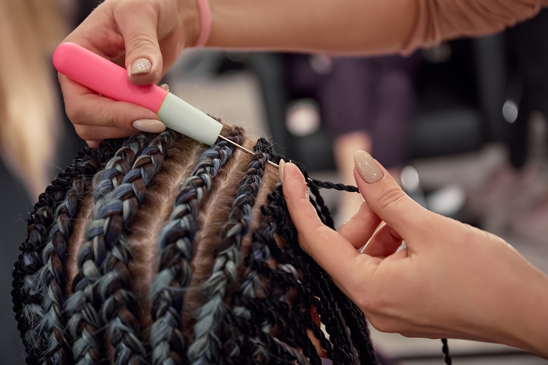 Beauty salon master works, Afro-braids and dreadlocks