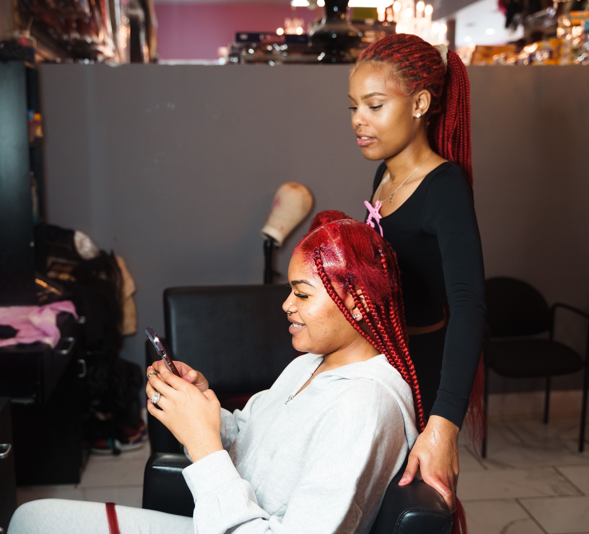 Stylist Braiding Hair in a Salon